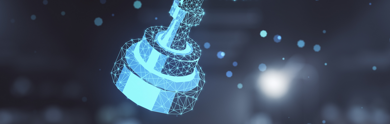 Eine Hand hält ein Tablet über dem ein 3D-Hologramm eines Pokals schwebt
